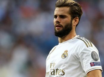 Nacho mencetak gol saat Real Madrid menang untuk menyingkirkan Barcelona